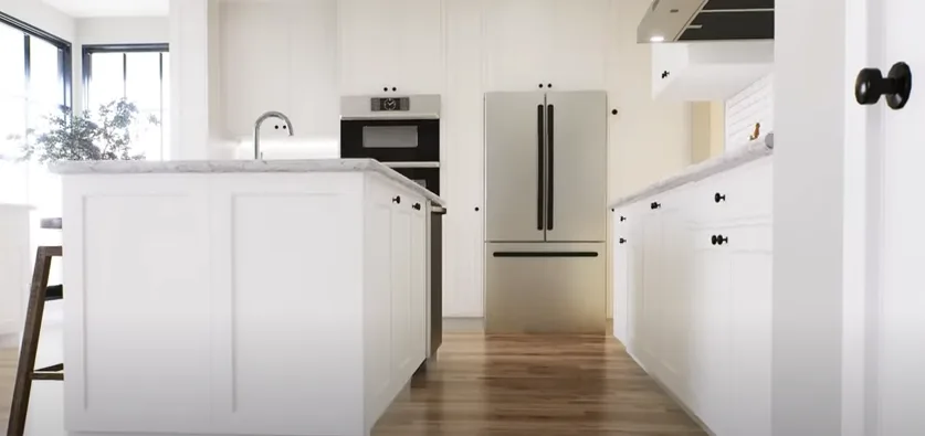 Image of a modern kitchen showing appliances that a home warranty covers.