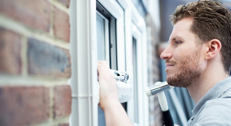 contractor installing new windows as main banner image for blog What to Know Before Getting New Windows
