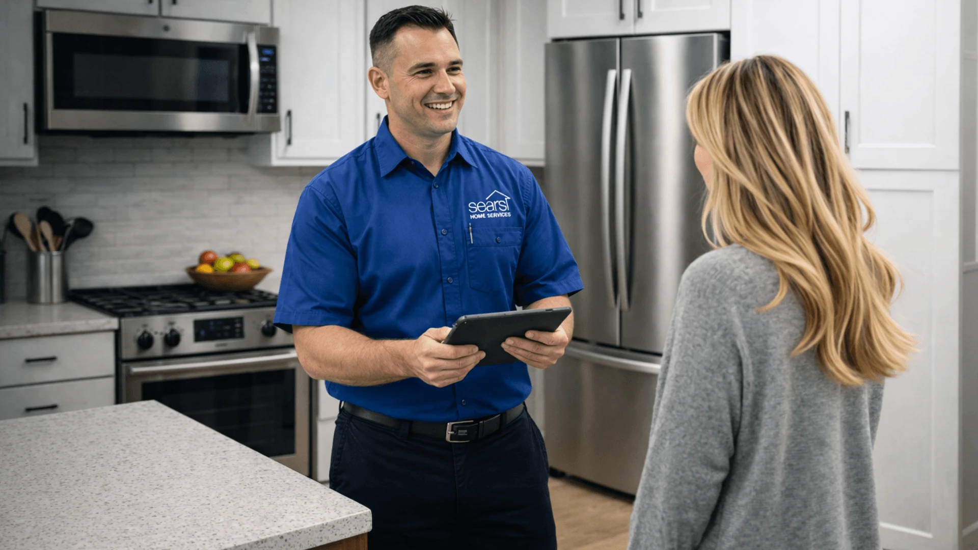Sears Home Services technician repairing a home appliance