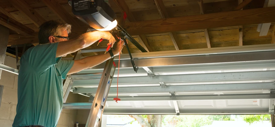 homeowner repairing a garage door