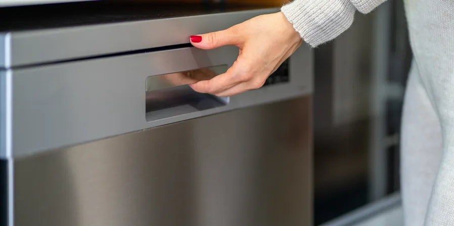 Homeowner finding a broken dishwasher door handle
