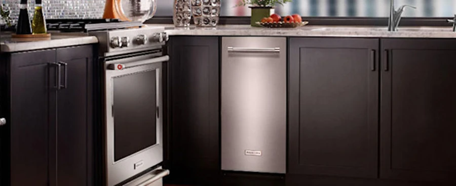 Modern kitchen with a trash compactor for article on "How Does a Trash Compactor Work?"