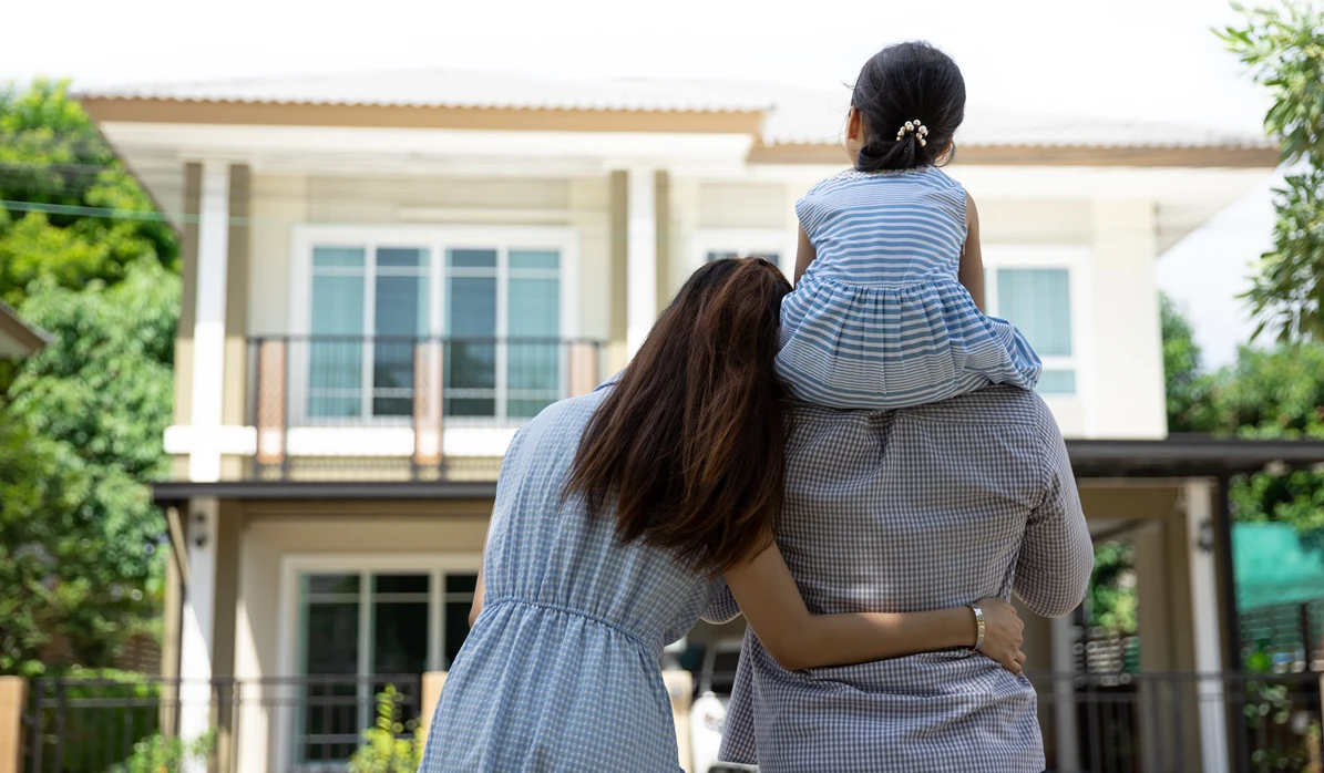 Image of new home buyers looking at their new construction home wondering what will be covered by a new home building warranty.