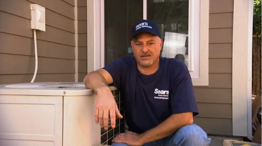 A Sears HVAC technician explaining how much a new AC compressor costs