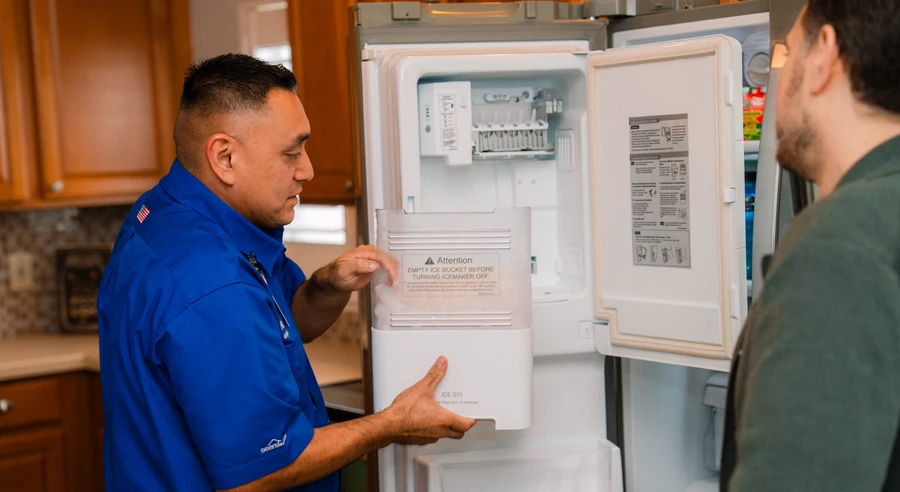 Sears Technician explaining to homeowner the reasons for an ice maker too slow in making ice cubes