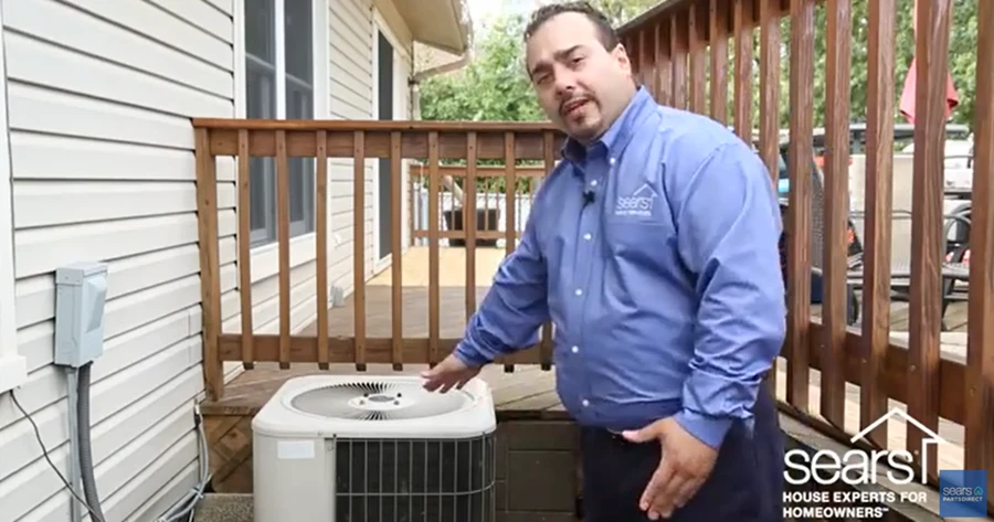 Sears technician explaining how an HVAC compressor works