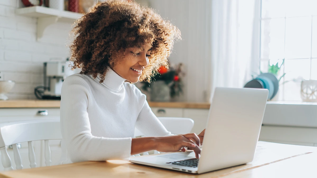 Homeowner researching home warranty companies on the web.