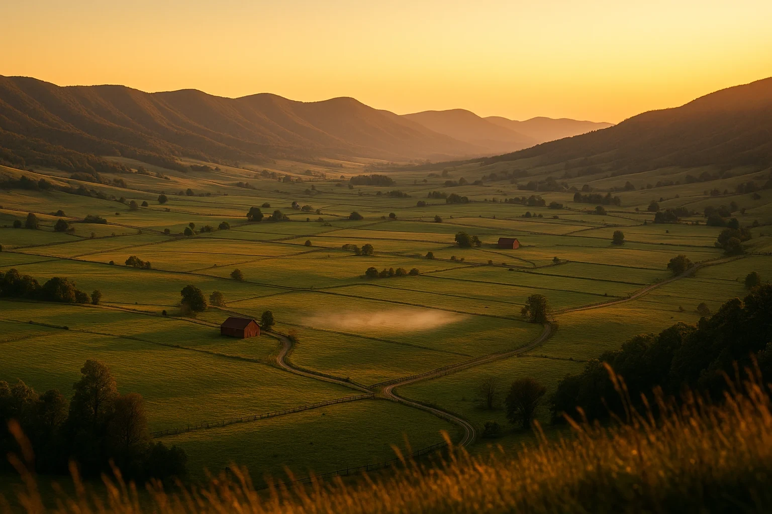 Golden sunset over rolling green farmland with red barns and misty mountain ridges near Tazewell.