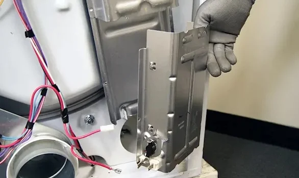 Replacing a clothes dryer heating element.
