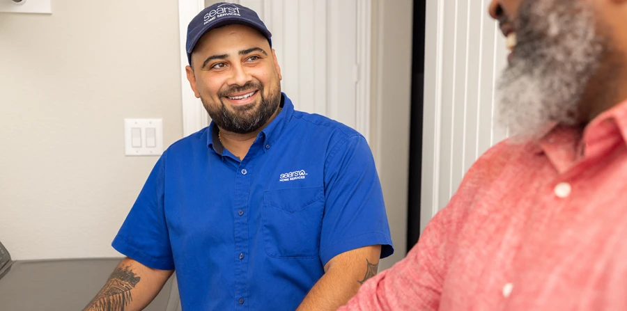 homeowner using a vetted Sears Home Services appliance technician