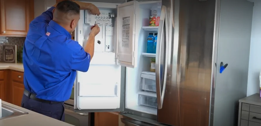 Sears Technician fixing a Maytag fridge problem